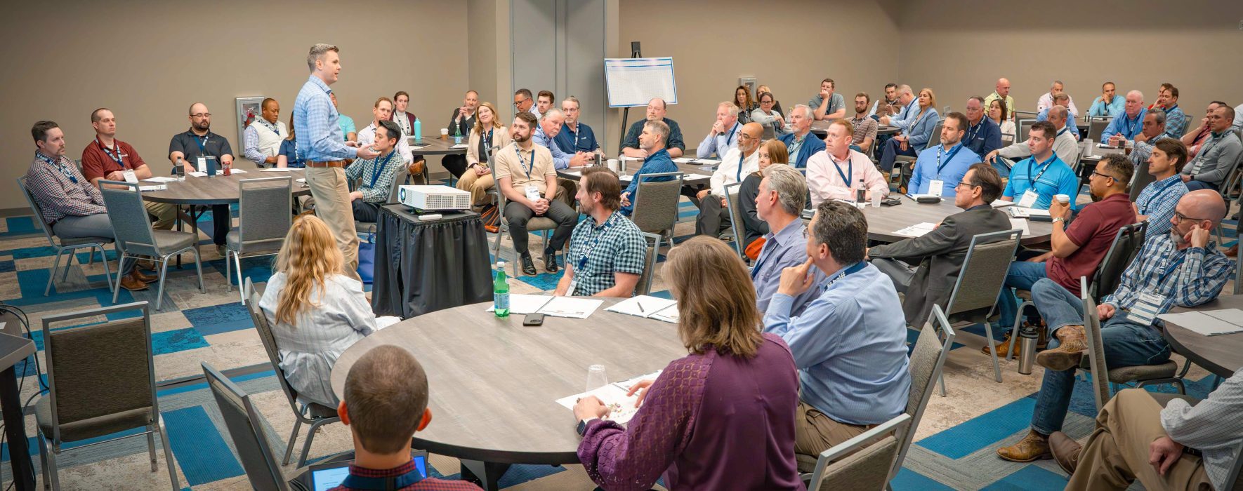 A group of employees sitting in a room investing in Career Development at Halff's Annual Leadership Forum 2024